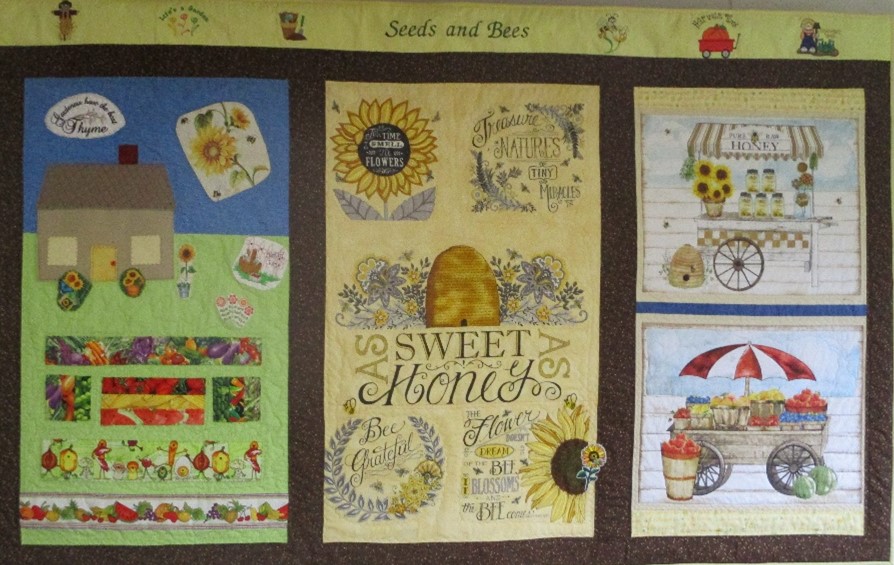 Joan Beyer made this quilt to depict the life cycle of a garden. It now hangs in our hall year around